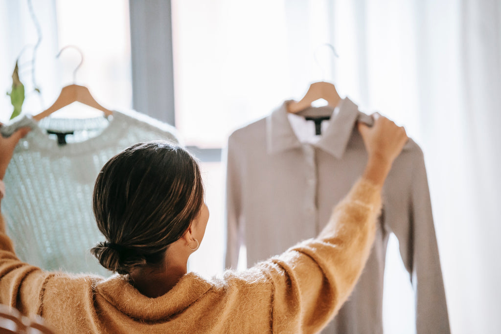 Photo by Liza Summer: Woman choosing clothes in a store