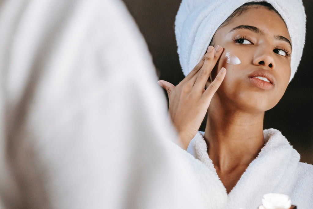Woman applying face cream. Image by Sora Shimazaki, courtesy of Pexels